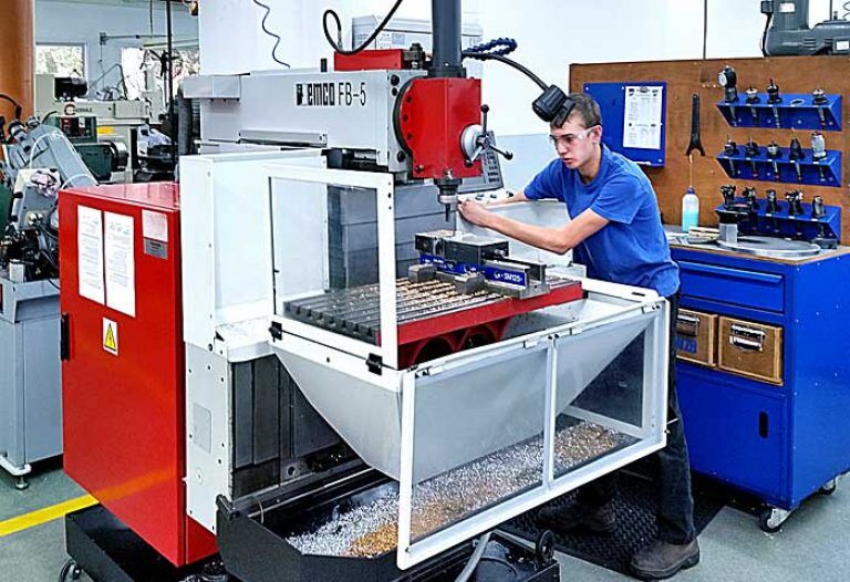 Training center student at the CNC machine